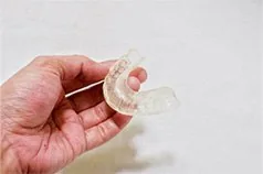 Close-up of a deprogrammer used for TMJ treatment