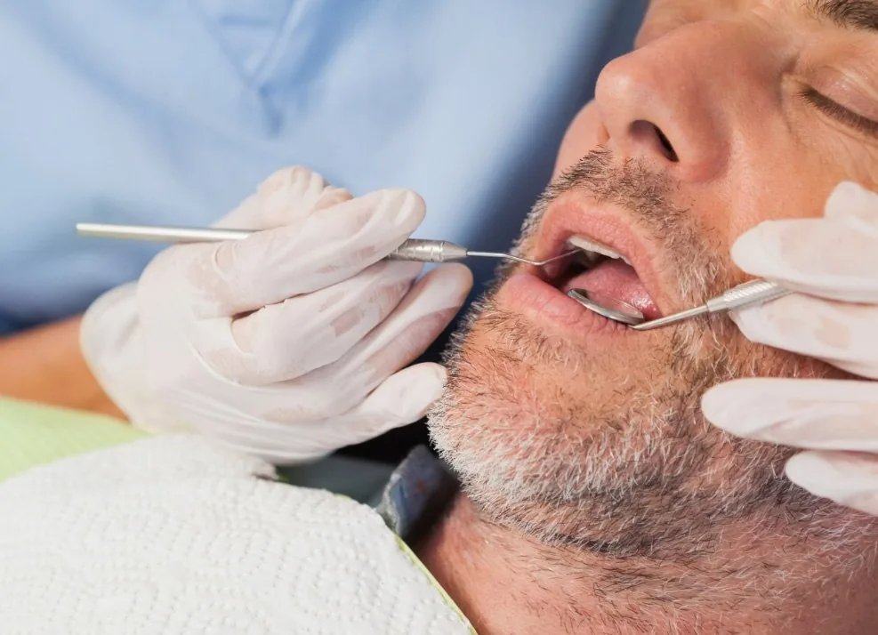 Man receiving dental treatment with sedation