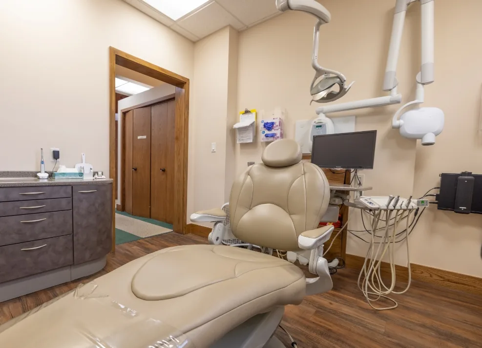 Dental exam chair with computer in the background