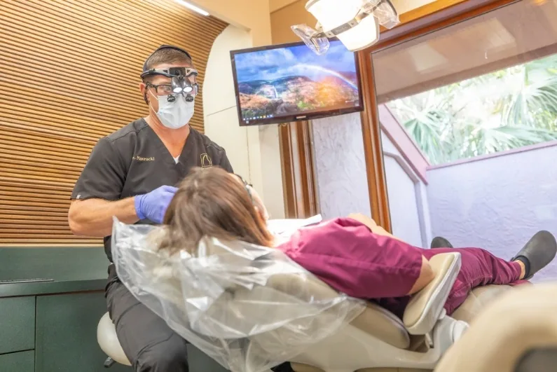 Dr. Nawrocki performing an oral cancer screening