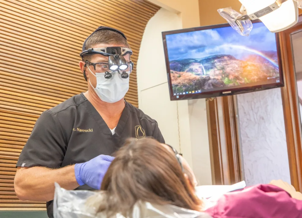 Dr. Nawrocki performing an emergency dental exam
