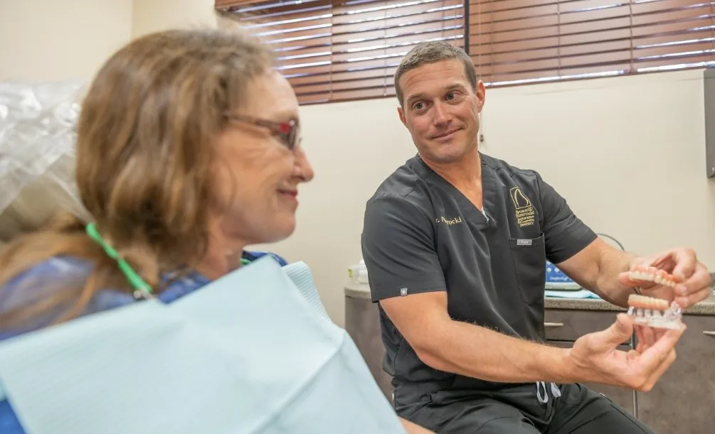 Dr. Nawrocki with a patient during a dental checkup