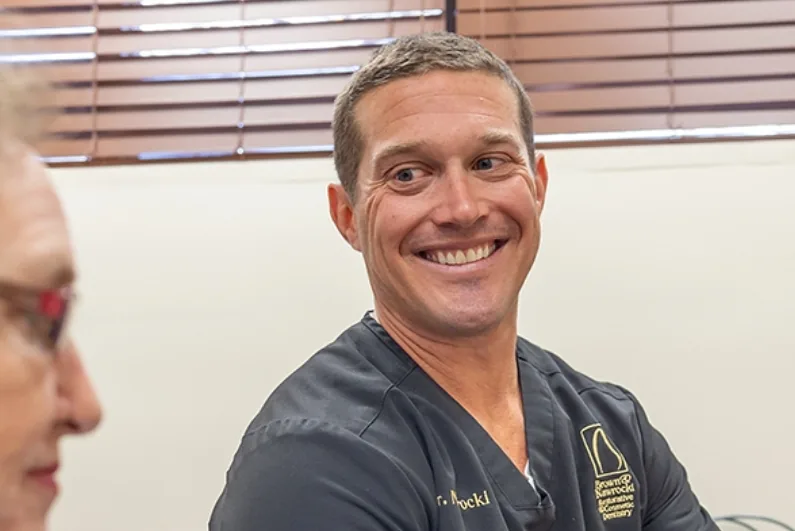 Ormond Beach prosthodontist Doctor Andrew Nawrocki smiling at a dental patient