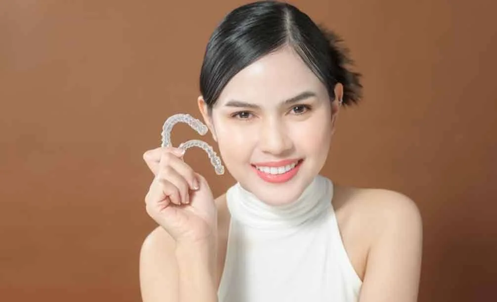 Woman thinking about Invisalign treatment