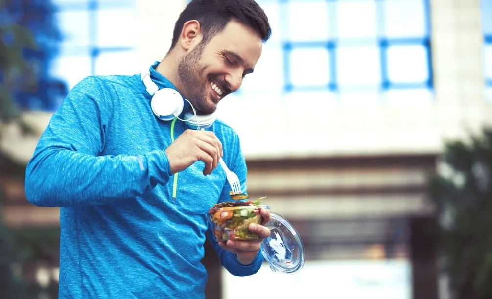 Man eating a healthy meal outdoors
