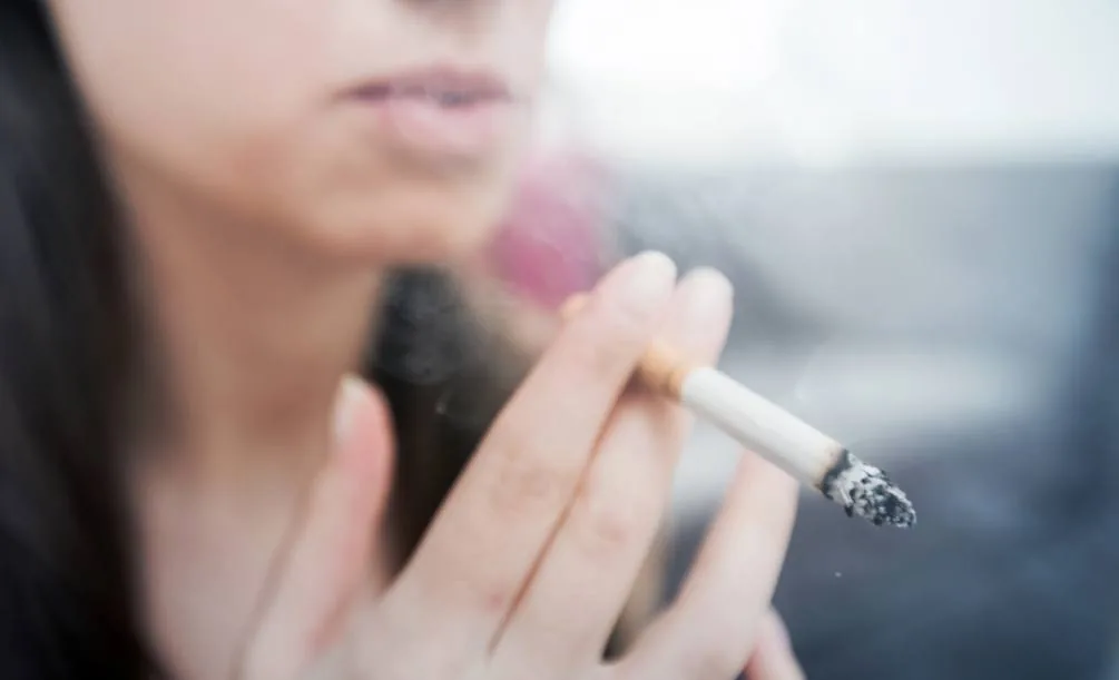 Close-up of a person smoking a cigarette