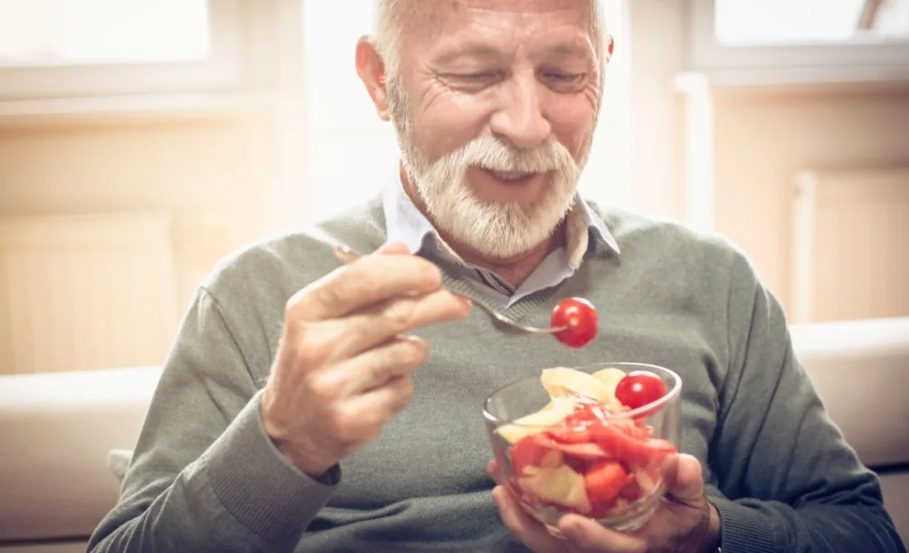Senior man eating a salad