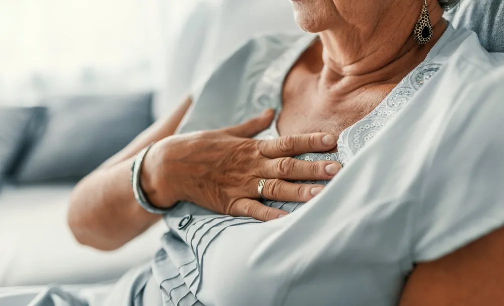 Senior woman with her hand over her heart