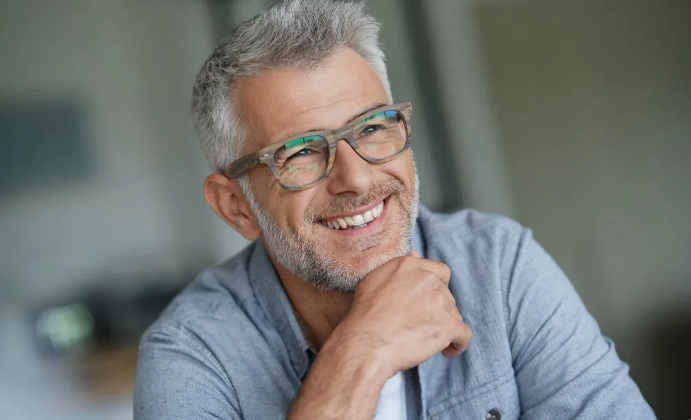 Smiling older man in glasses