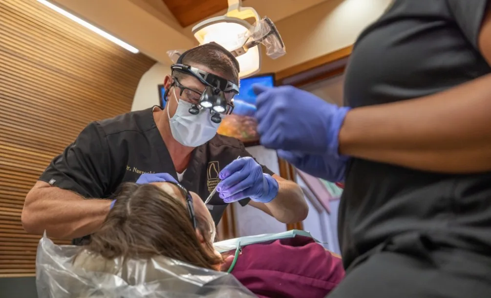 Dr. Nawrocki performing a tooth extraction