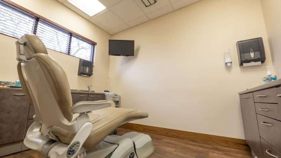 Dental exam room with sunlight streaming through a window