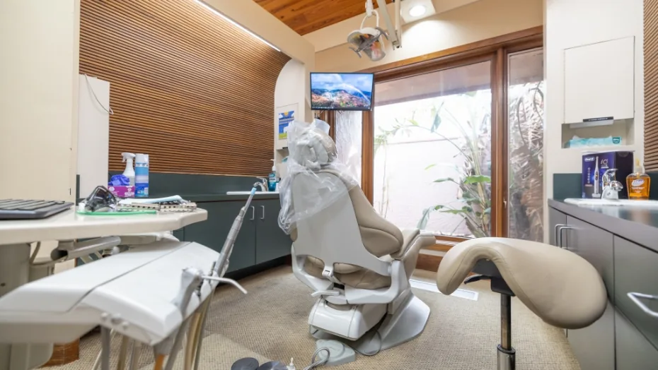 Dental instruments arranged behind a dental exam chair
