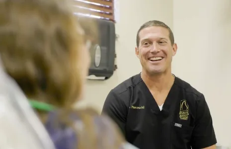 Dental team members treating a patient in Ormond Beach