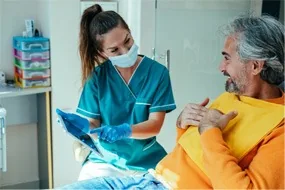 Patient speaking with dentist about wisdom tooth extraction