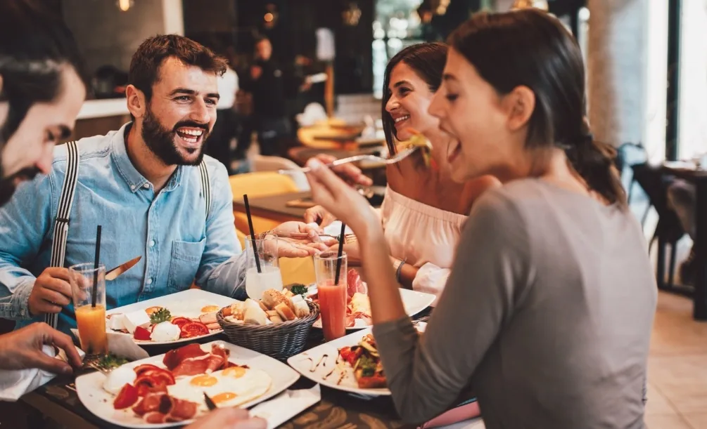Woman enjoying a meal with friends