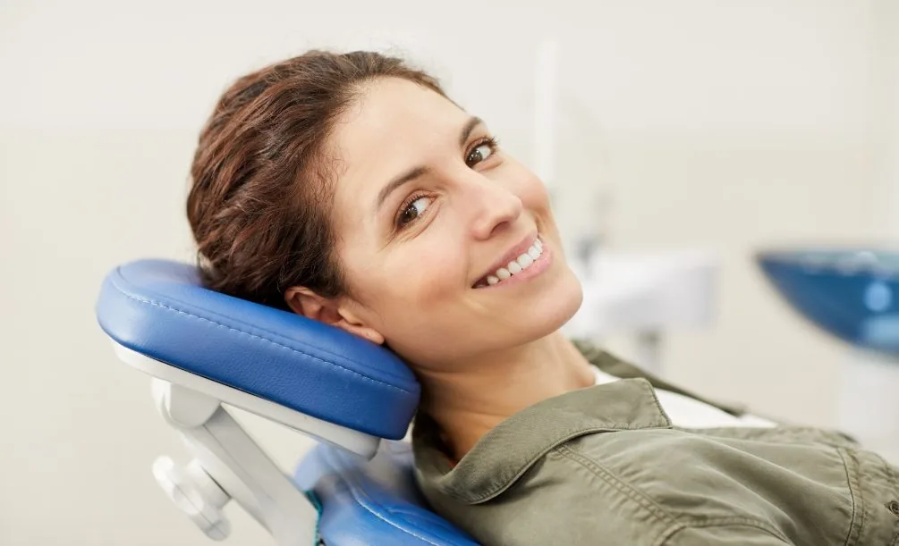Woman smiling in a dental chair