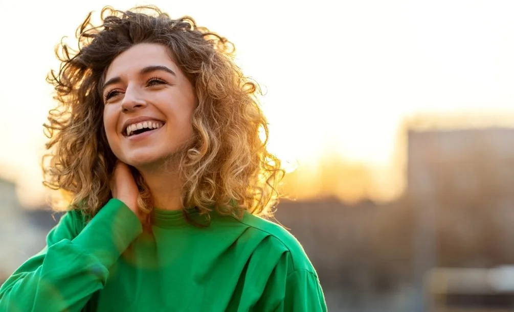 Young woman smiling outdoors